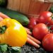 Vegetables in a garden.  Selective focus on stem of yellow pepper